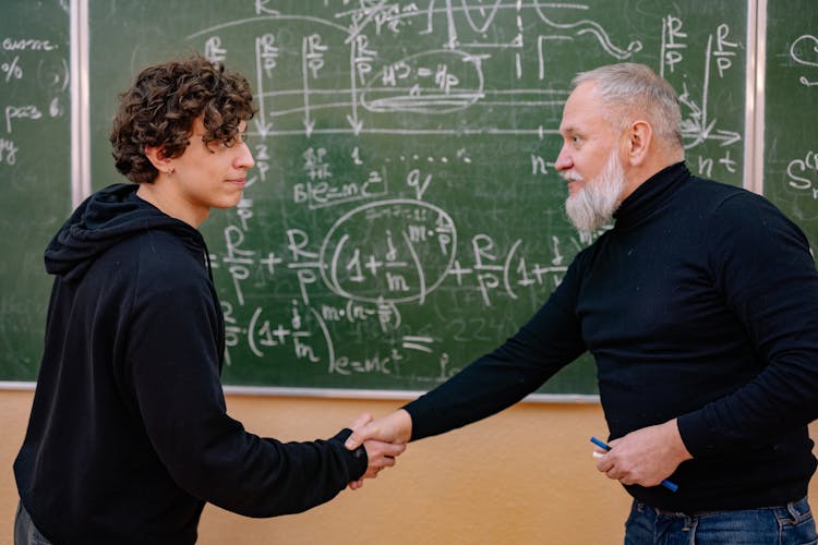 Professor And A Student Shaking Hands