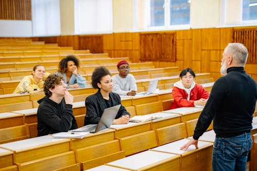Free Professor Standing in Front of his Students Stock Photo
