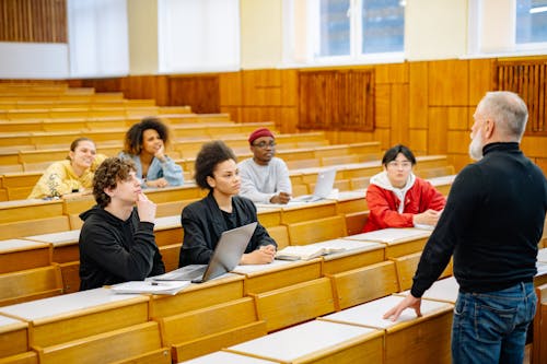 Professor Standing in Front of his Students