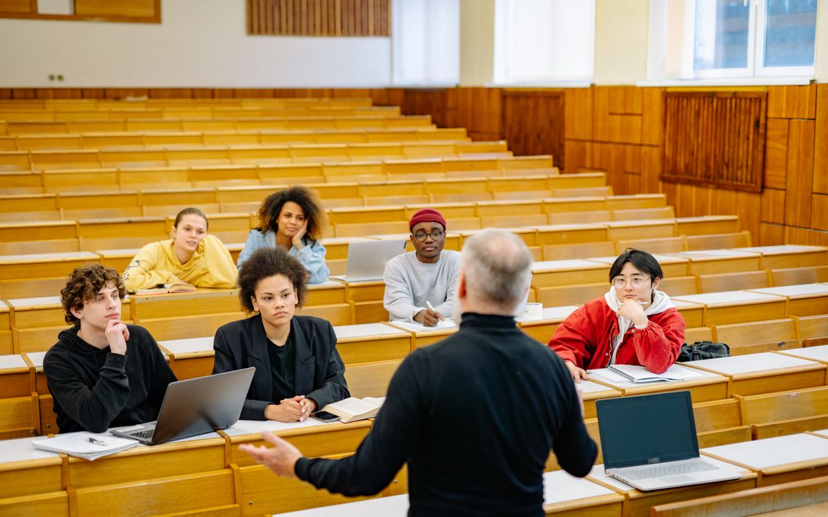 Professor teaching a diverse group of university students