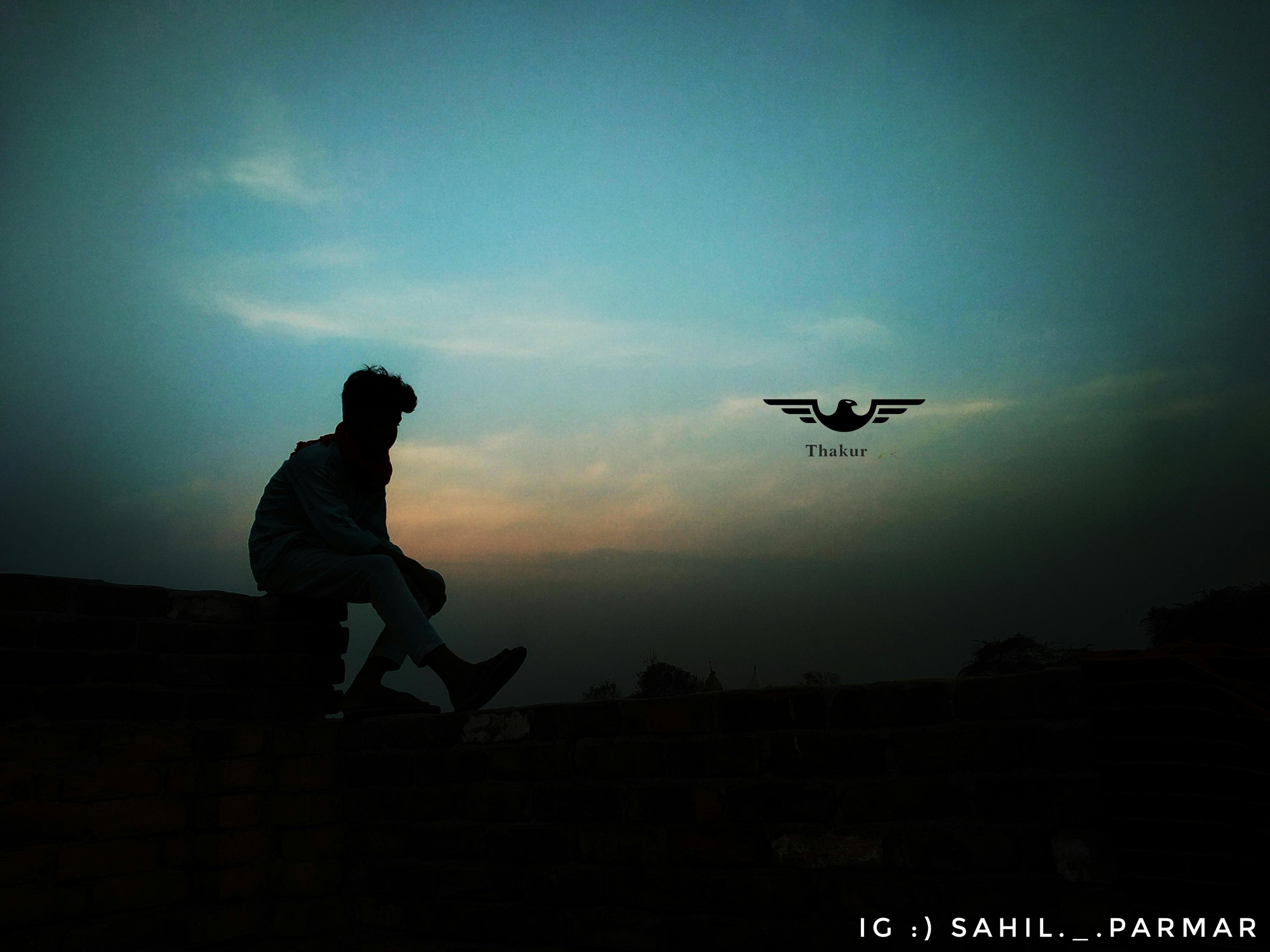 A person scrolling through social media feeds on a smartphone, with various platform logos visible in the background.