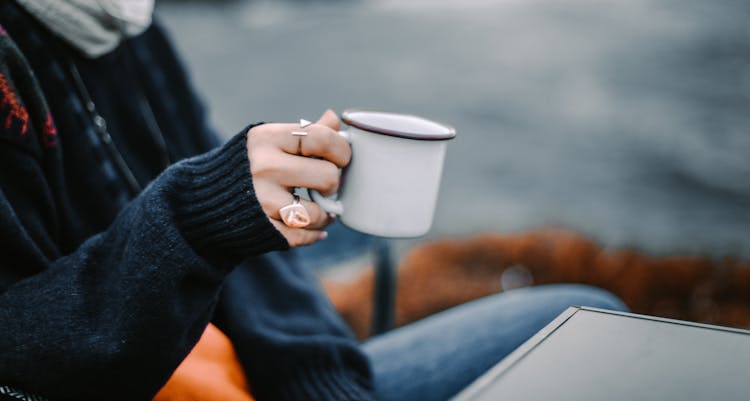 Person Holding White Ceramic Mug