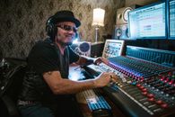 Man in Black Shirt Playing Audio Mixer