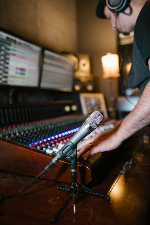 Free Microphone on a Mic Stand next to an Audio Equipment Stock Photo