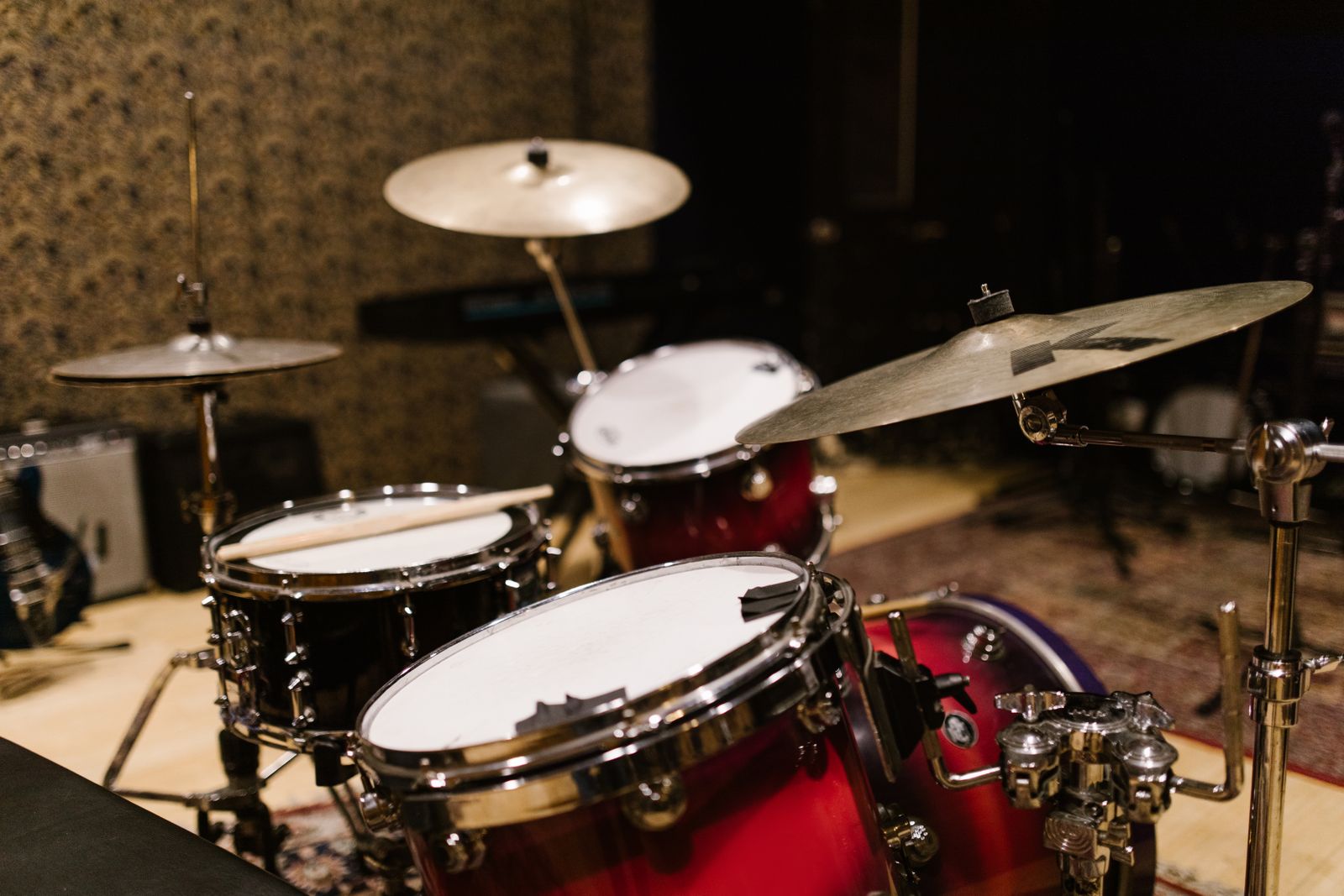 Acoustic drum kit with cymbals set up in a music studio