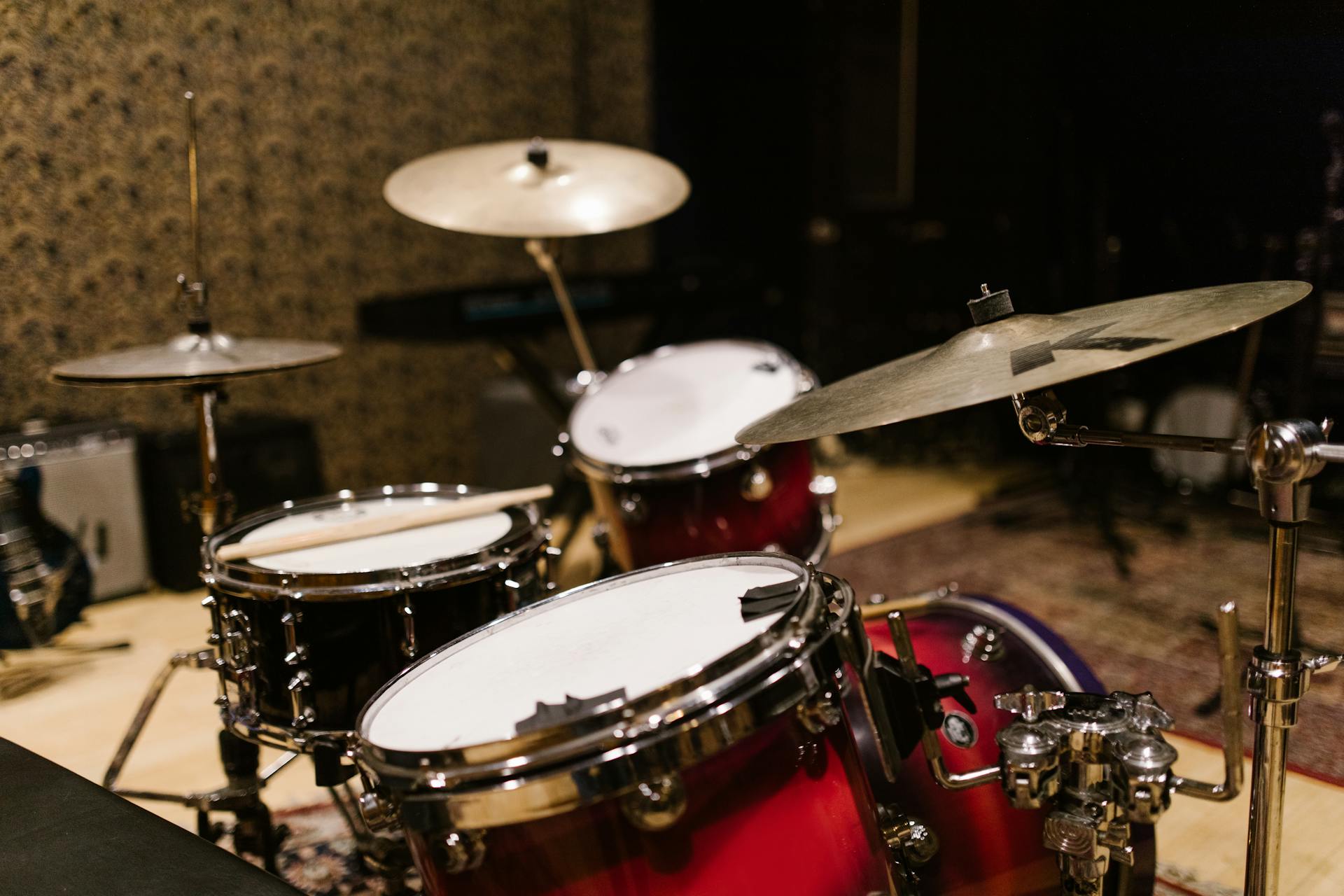 Close-up of a drum set with cymbals in a music studio, showcasing professional percussion instruments.
