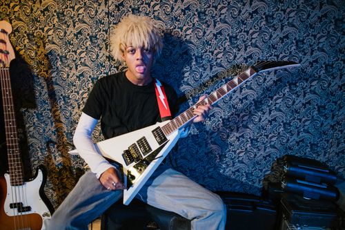 Free A musician passionately playing an electric guitar in a studio setting, expressing emotion. Stock Photo