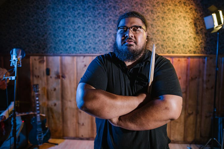 A Drummer Holding His Drumsticks