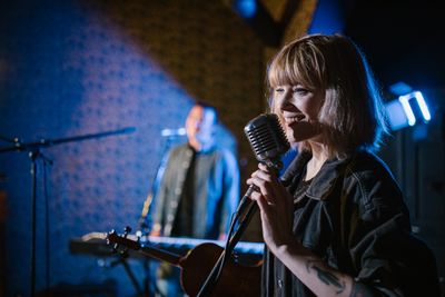 Singer performing with vintage microphone