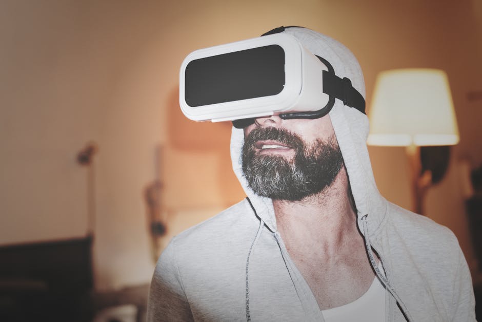 Man Wearing Gray Hoodie and White Virtual-reality Headset