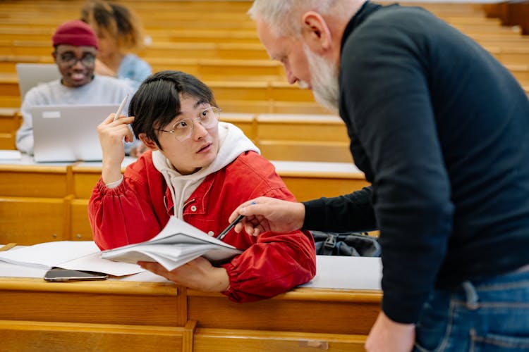 Teacher Teaching A College Student