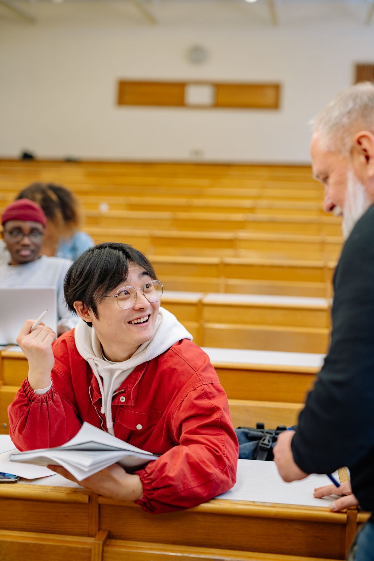 Professor and students in a university lecture hall