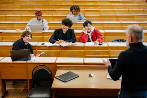Free A Professor Interacting with His Students Stock Photo