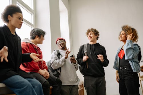 Students Talking while on a Staircase Landing