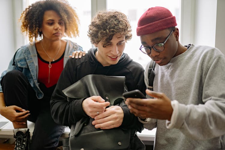 Friends Looking At A Cellphone