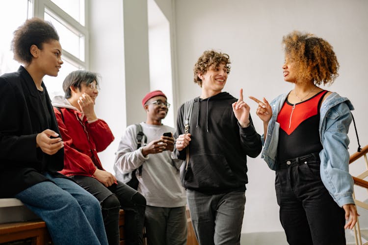 A Group Of Students Having Conversation