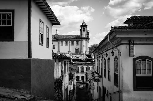 Free Black and white photo of colonial architecture in Ouro Preto with a church view. Stock Photo