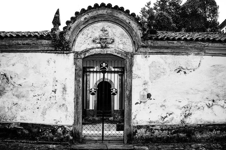 Old Broken Wall With A Gate 