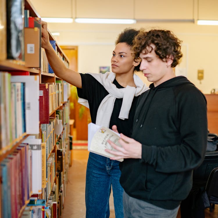 Man And Woman In Library