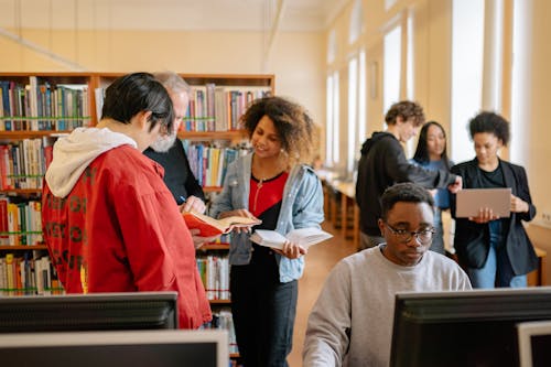 Three People in the Library · Free Stock Photo