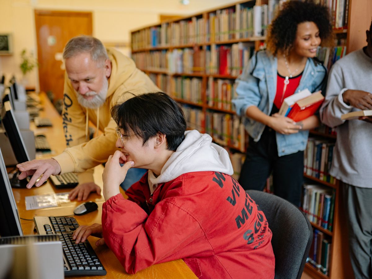 Students working on computers in a campus library