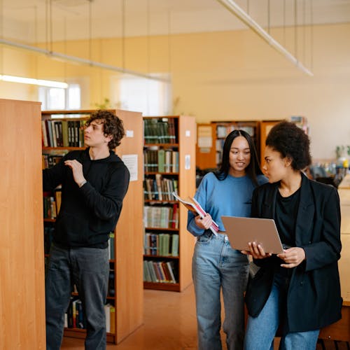 Three People inside the Library