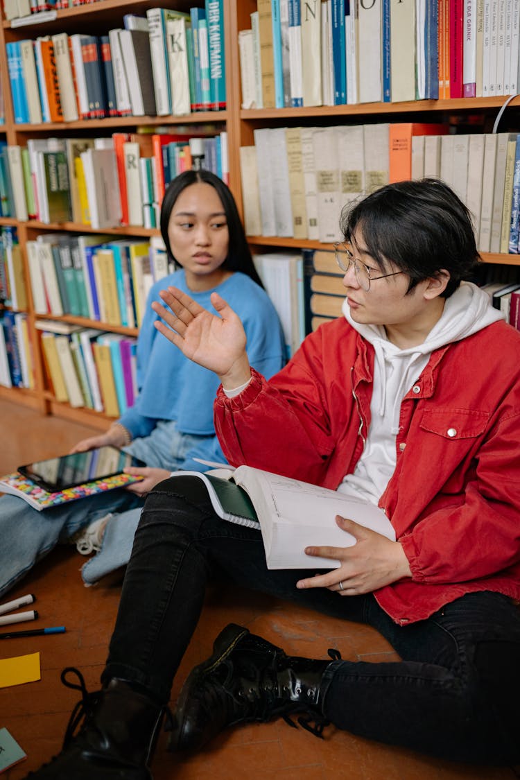 Couple Studying In Library Toget