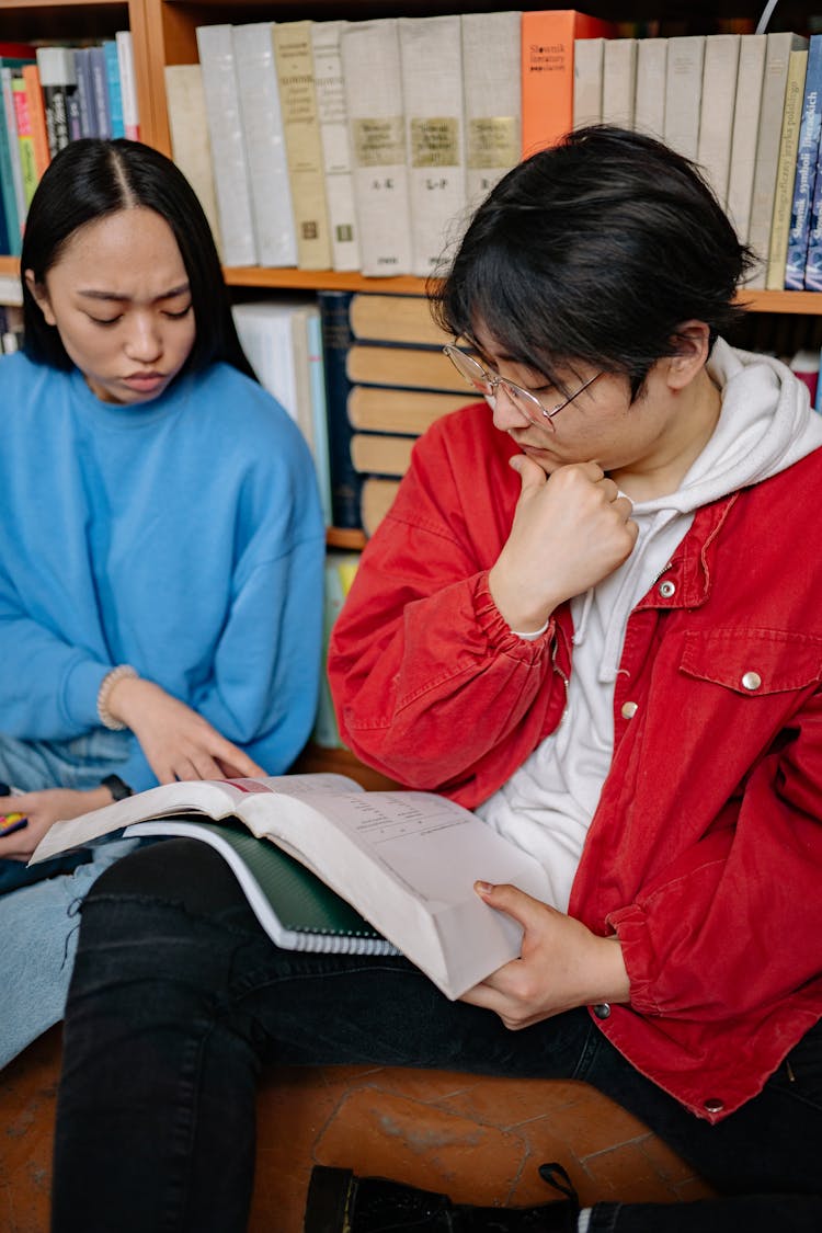 Two Students Reading A Book