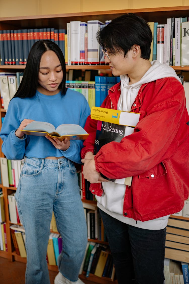 Man And Woman Talking Inside The Library