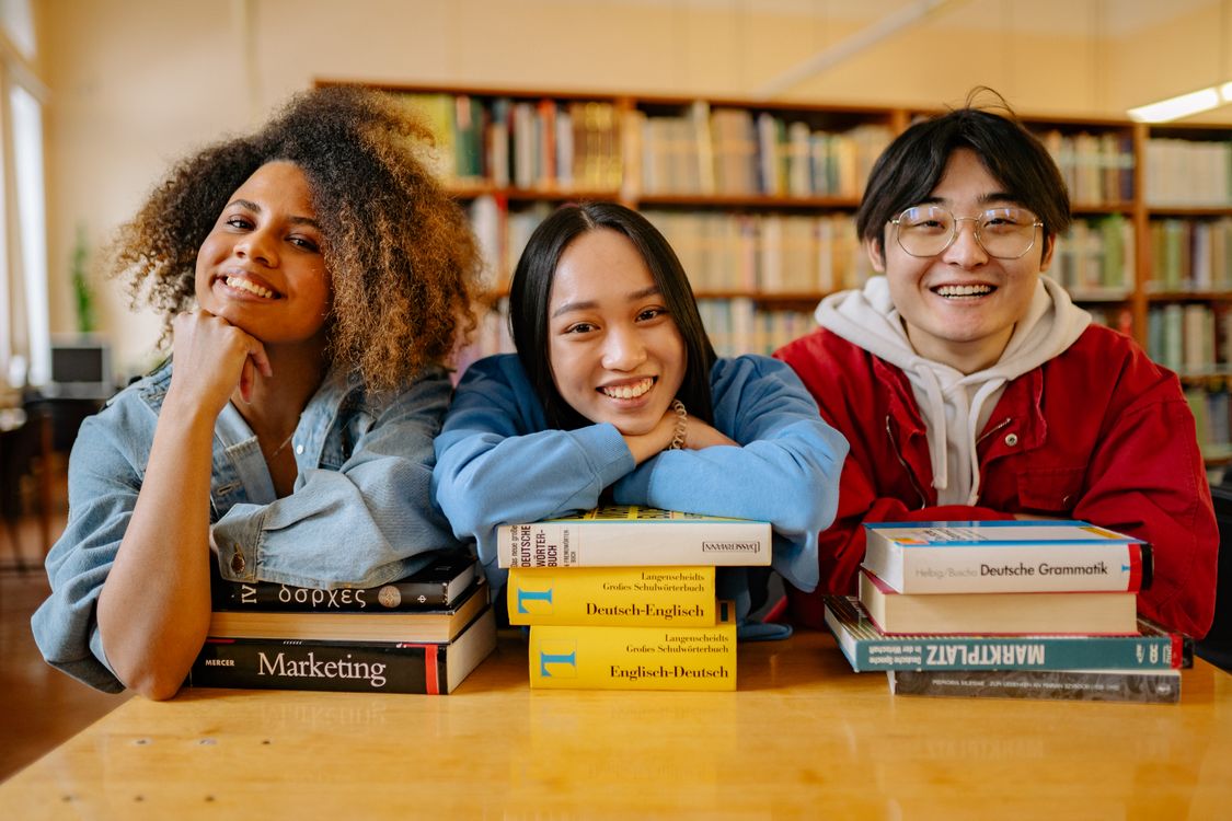 Humans In Library People Sitting in a Library · Free Stock Photo