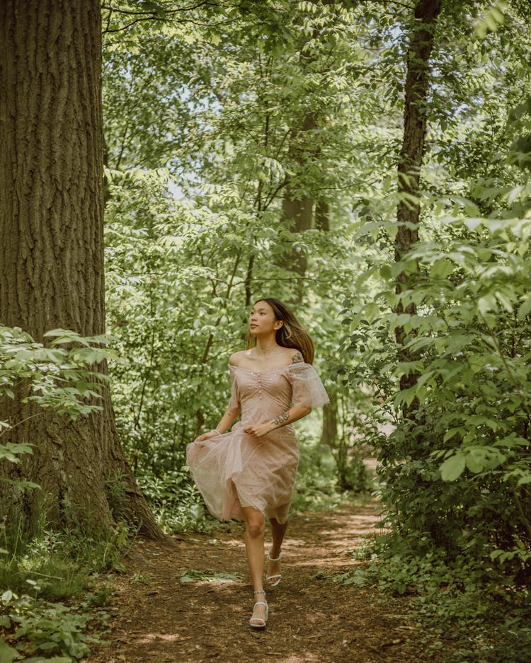 Woman Walking In The Forest 