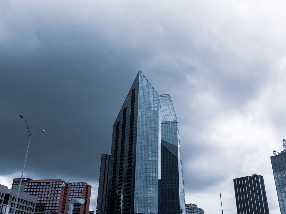 Modern Glass Skyscraper Against the Cloudy Sky · Free Stock Photo