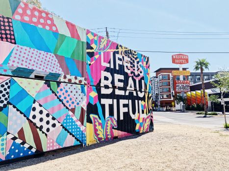 Vibrant street art mural in Las Vegas near the iconic Western Hotel.