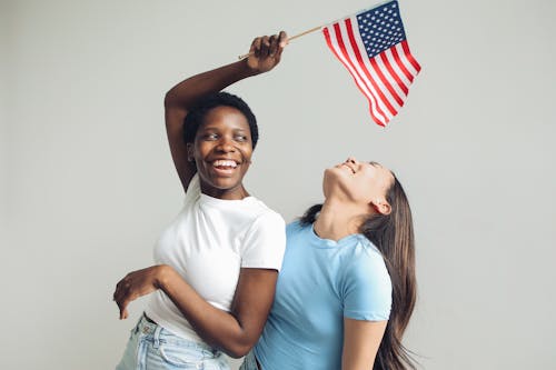 Бесплатное стоковое фото с 4 июля, американский флаг, афро-американка