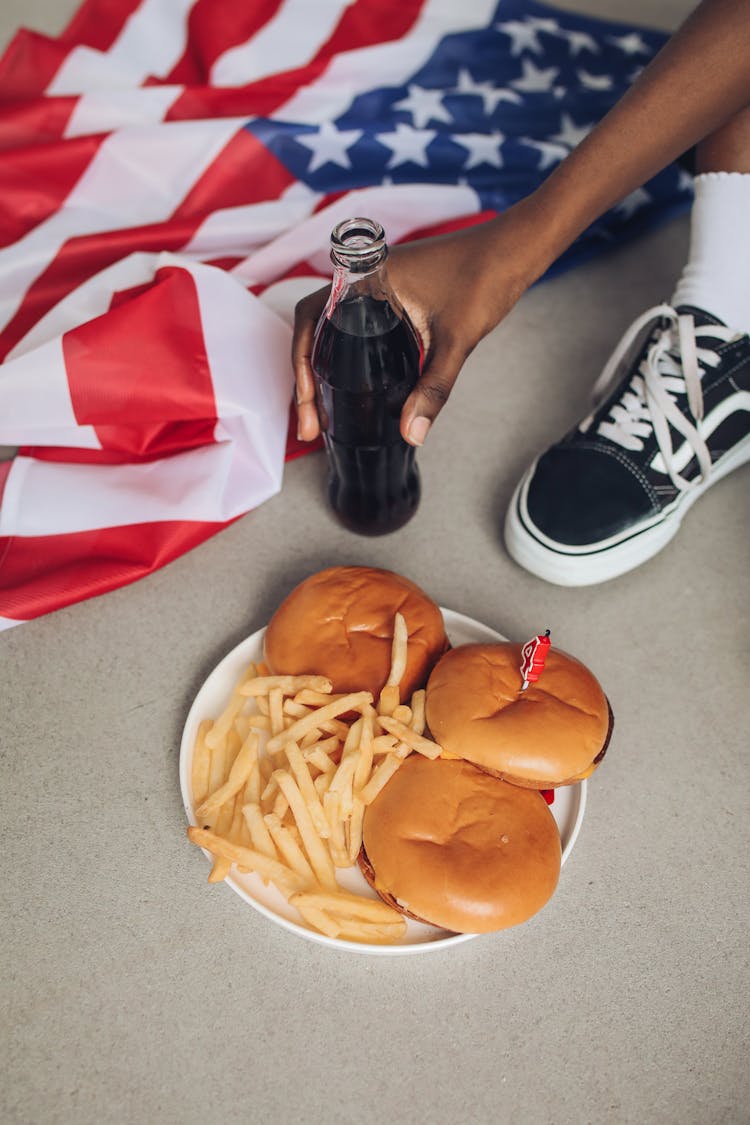 Burgers And Fries On White Plate