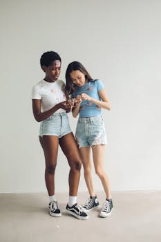 Two women enjoying 4th of July indoors with USA-themed attire.