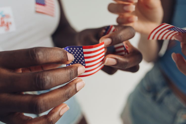 Person Holding A Sticker Flag