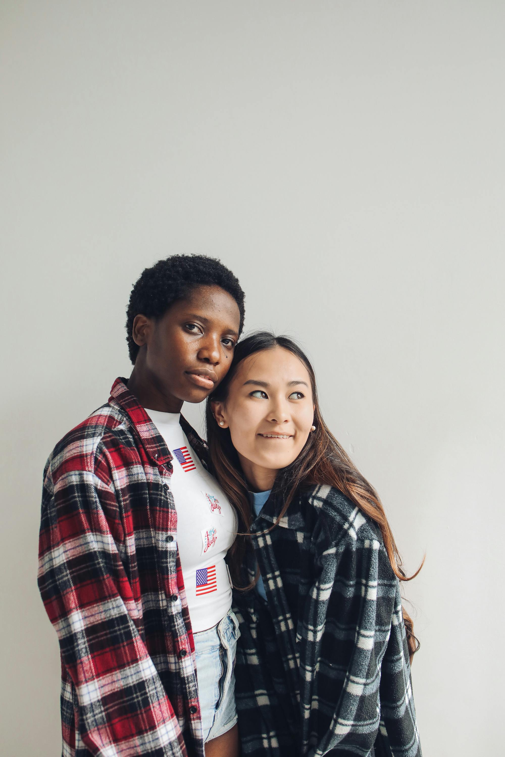 women wearing plaid tops