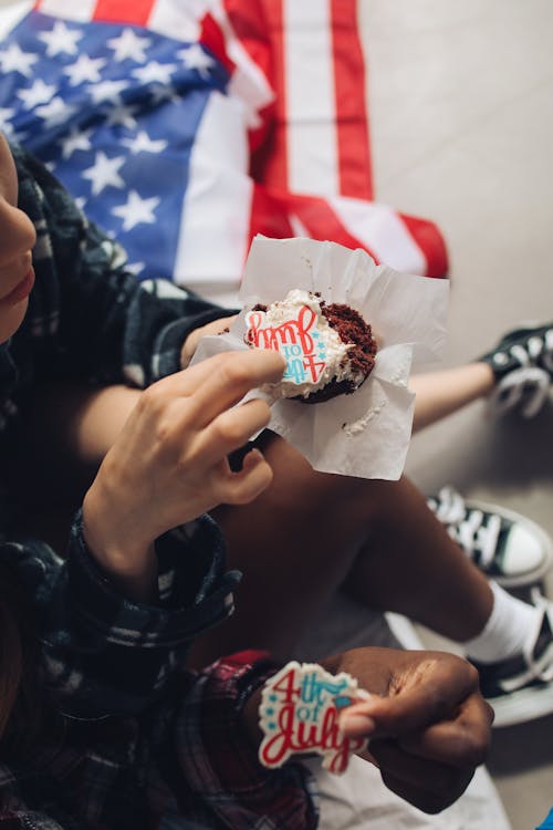 Person Holding a Cupcake