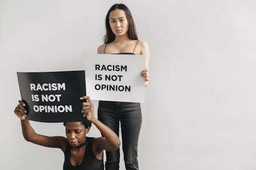 Women with Racism is Not Opinion Placards