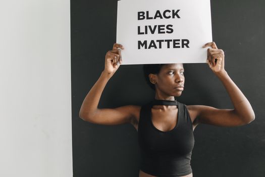 Woman Holding a Signage