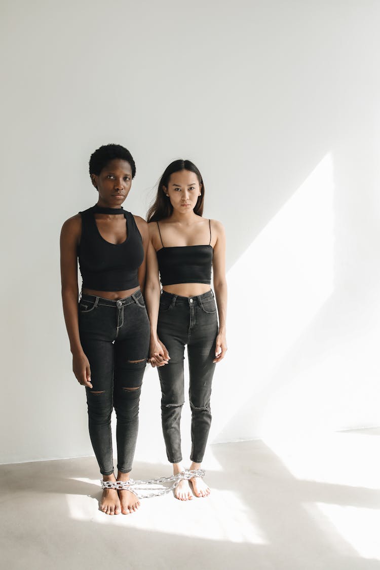 Women With Feet Chained Together