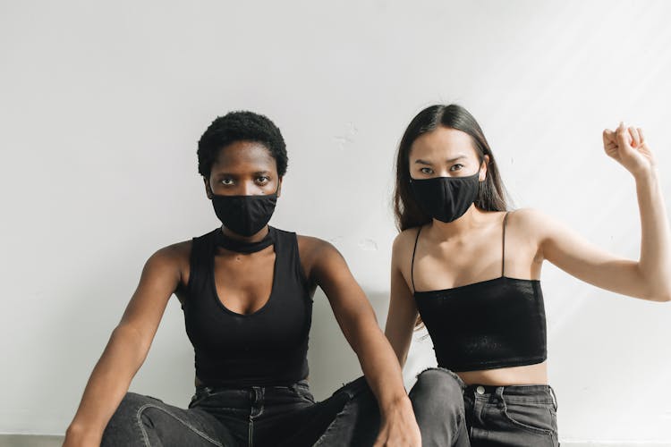 Activist Women Wearing Black Facemasks 