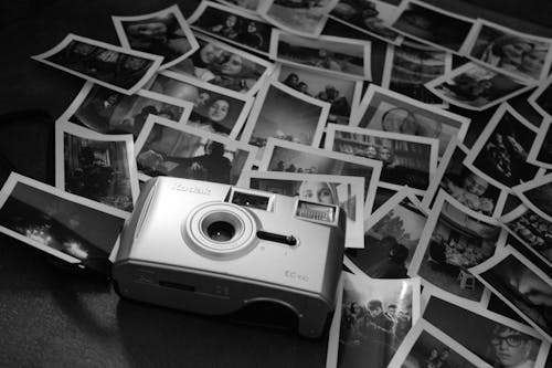 Monochrome Photo of Camera Near Photos