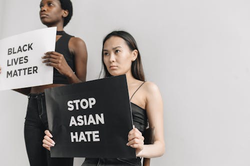 Women Holding Posters on Racism