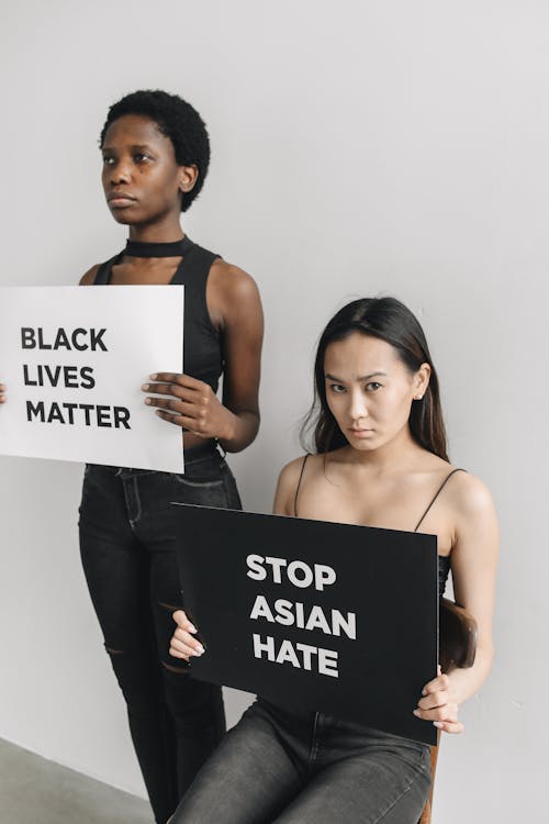 Women Holding Placards on Racism