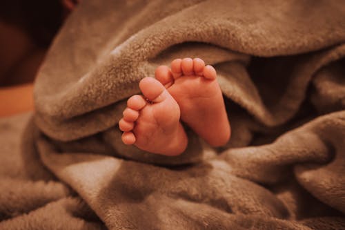 Close-Up Shot of Tiny Feet of an Infant