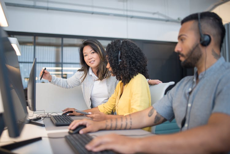 Three People Working In The Office