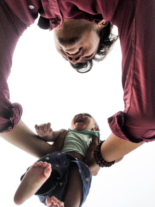 Smiling Father Playing with Child