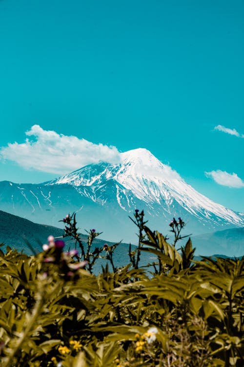 Snow Covered Mountain Under Blue Sky